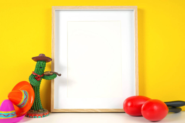 Cinco de Mayo vertical frame mockup against a festive yellow background. - Foto, Bild