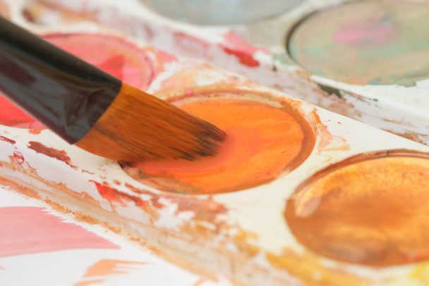 Close up image of a paint brush. Creative hobby or art therapy concept. - 写真・画像