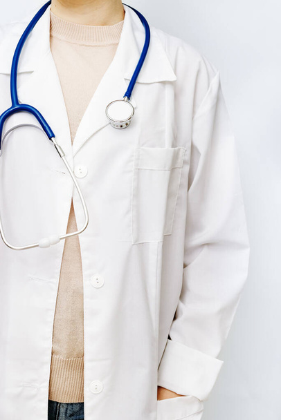 Medicine doctor close up in white coat with stethoscope. Healthcare and medical background. - Фото, зображення