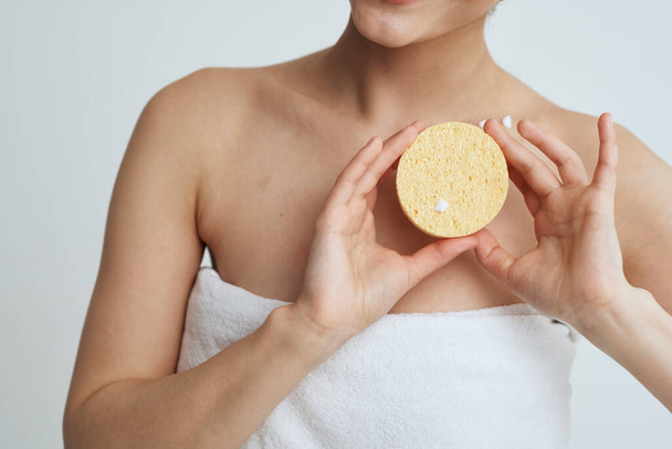 Woman in white towel bare shoulders clean skin after shower close-up - Fotografie, Obrázek