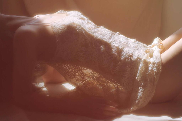 woman in lingerie on a bed - Фото, зображення