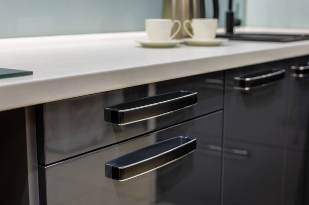 Original innovative kitchen cabinet handles. Kitchen design. - Фото, изображение