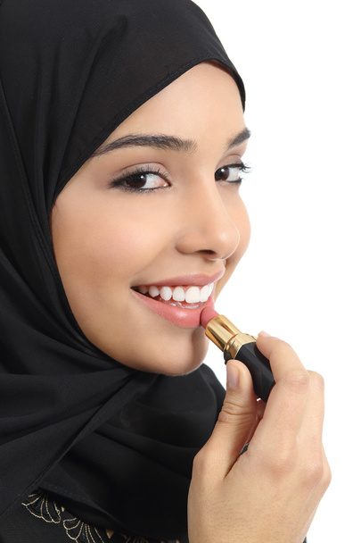 Arab saudi emirates woman painting her lips with a lipstick - Foto, Imagen