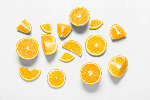 Tasty orange pieces on white background - Photo, Image
