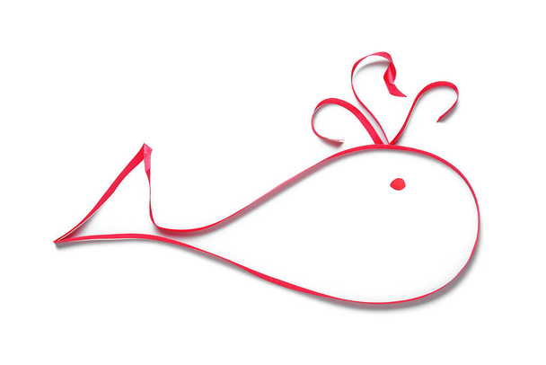 Whale made of red ribbon on white background - Fotó, kép