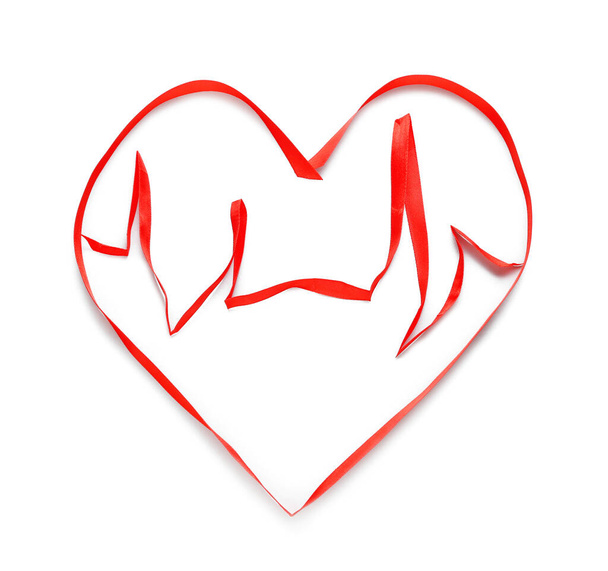 Heart shape made of red ribbon on white background - Photo, Image