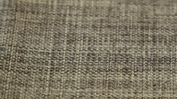 Bruine stof textuur voor achtergrond, naadloos patroon van natuurlijke textiel., close-up - Video