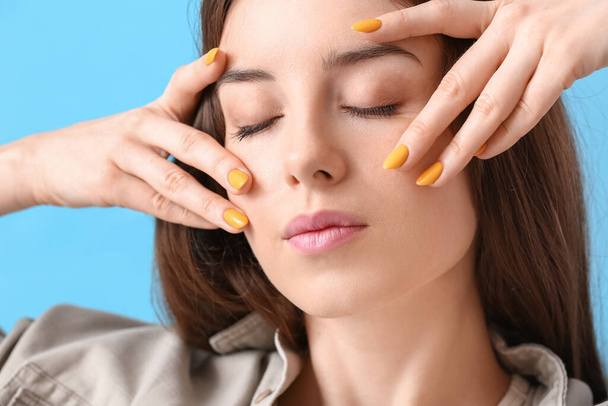 Young woman with beautiful manicure on color background - Fotoğraf, Görsel