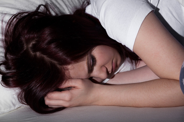 Woman sleeping at night - Photo, image