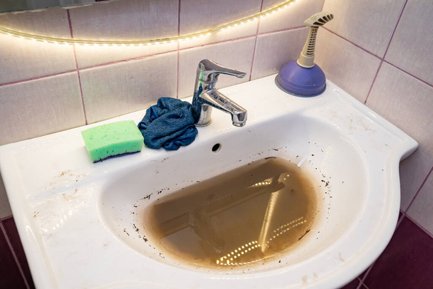 sink with dirty water because of the blockage. - Photo, Image
