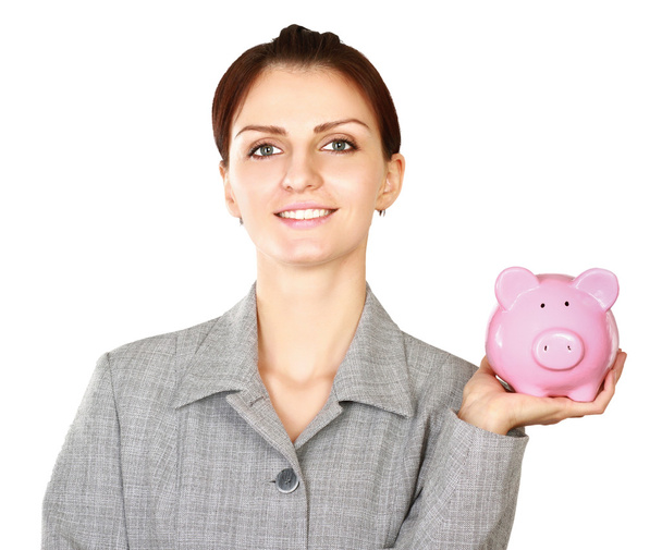 Woman standing with piggy bank - Valokuva, kuva