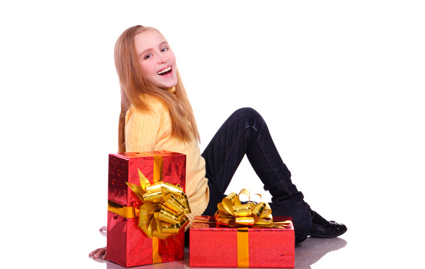 Beautiful smiling girl with a gift. isolated on white - Φωτογραφία, εικόνα