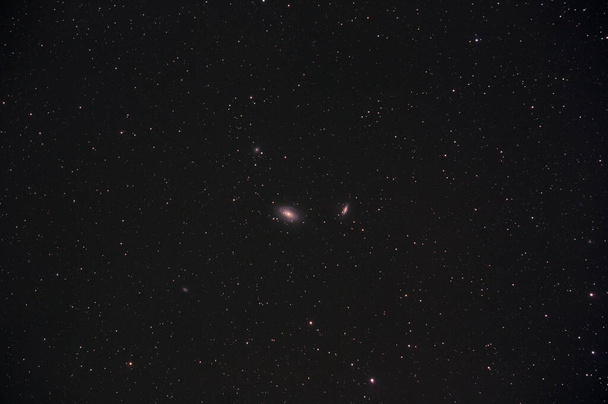 M81 and M82 galaxies in Ursa Major constellation photographed with long exposure through a telescope. - Photo, Image