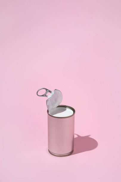 Silver can with coconut milk on pastel pink background. Retro sc - Photo, Image