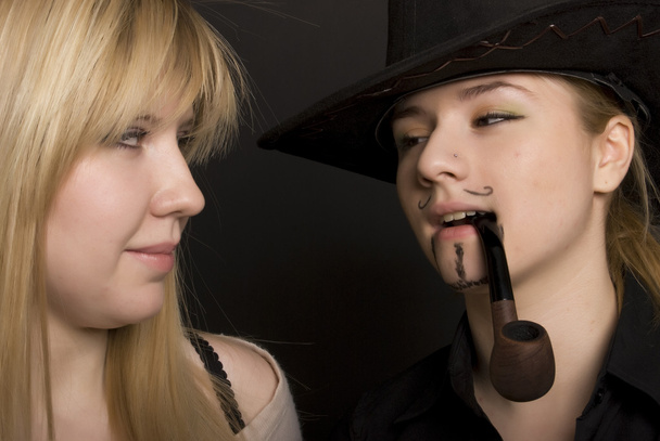 Young blonde with cowboy-like girl - 写真・画像