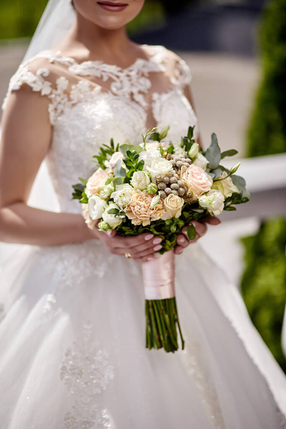 bouquet in hands of the bride, woman getting ready before wedding ceremony - Fotoğraf, Görsel