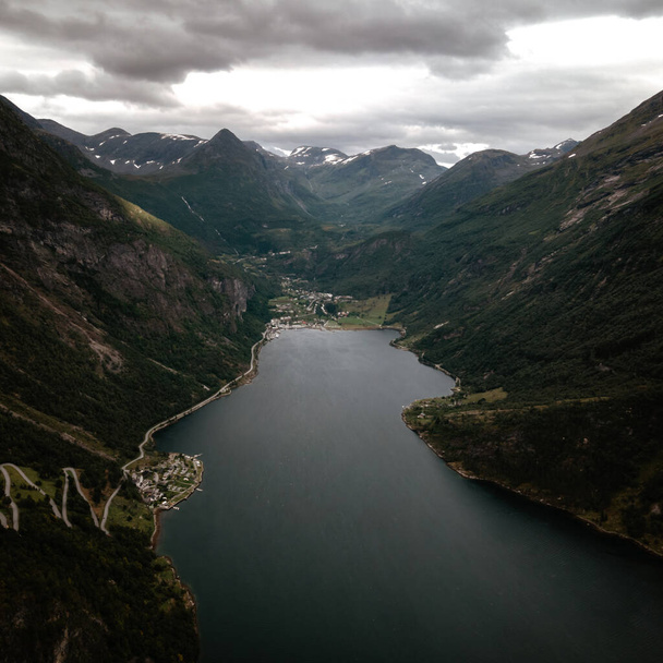 A vertical shot of the scenic hills of Geiranger and river Fjord in Norway - Φωτογραφία, εικόνα
