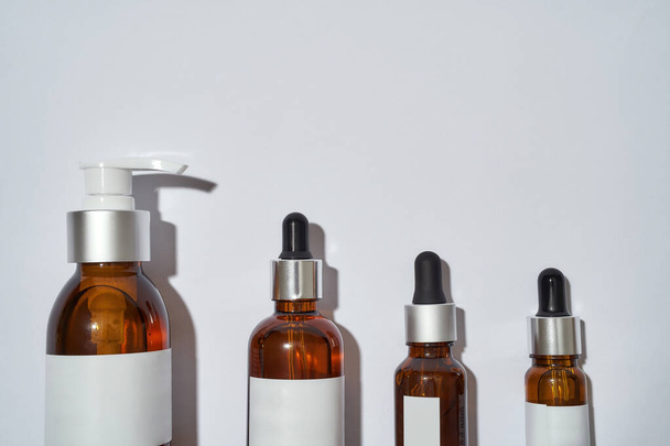 Glass bottles filled with cosmetological oils - Photo, Image