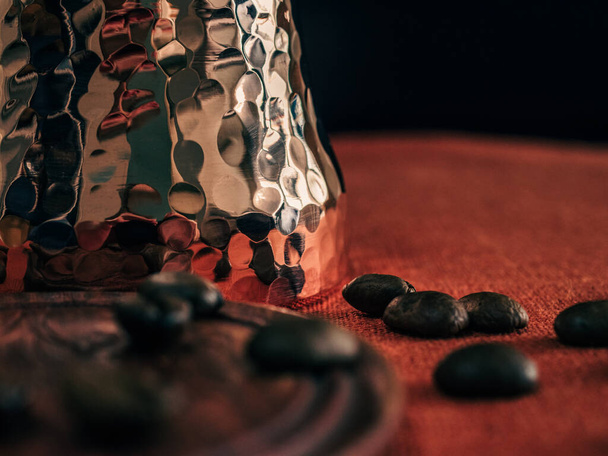 Cezve and coffee bean at the table closeup - Fotó, kép