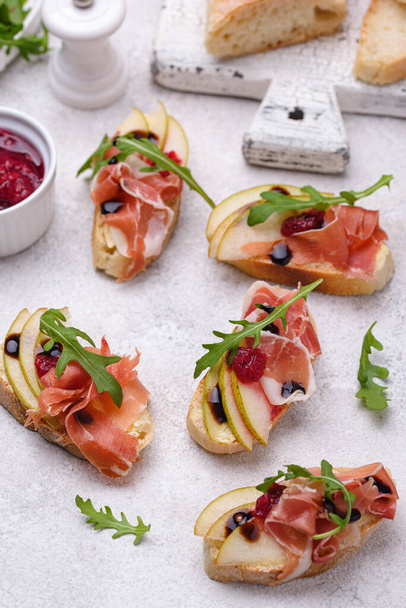 Toasts with pear and prosciutto - Photo, Image