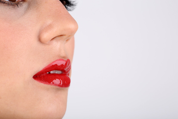 Sexy red lips closeup - Foto, afbeelding