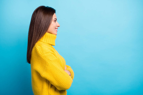 Profile side view portrait of lovely content cheerful girl folded arms copy empty blank space isolated over shine blue color background - Zdjęcie, obraz