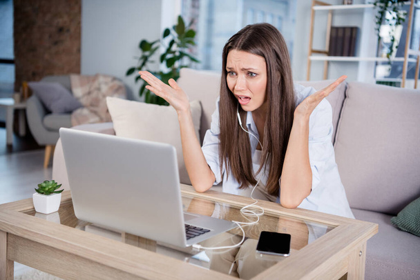Photo of shocked amazed unhappy upset businesswoman having problem trouble on video conference remote work at home - Photo, Image