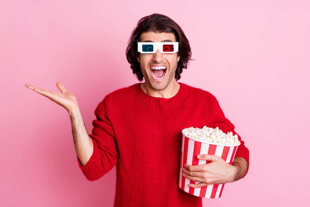 Photo portrait of funny laughing man watching comedy wearing 3d glasses keeping copyspace on hand isolated on pastel pink color background - Photo, image