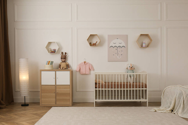 Modern baby room interior with stylish furniture and toys - Foto, afbeelding