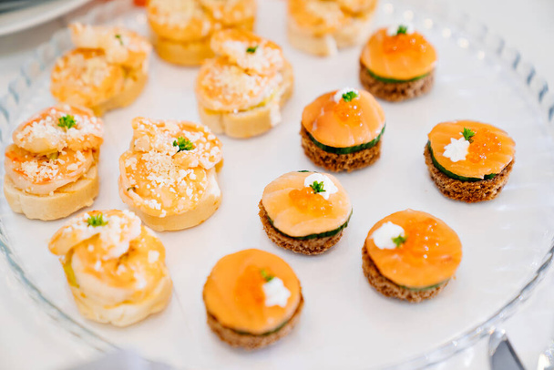 canapes. A convenient buffet feed. little sandwiches at the festival.  - Photo, Image