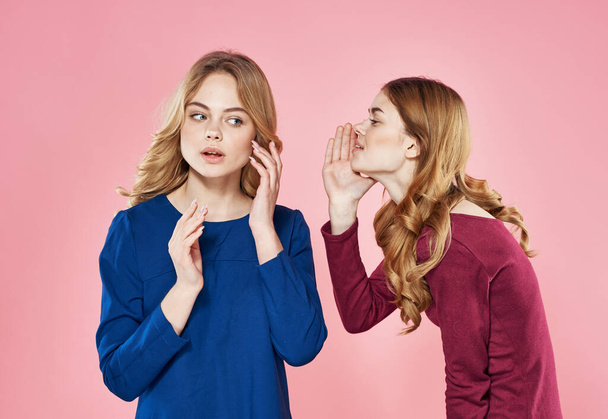 two cheerful women communicating elegant style lifestyle pink background - Fotó, kép