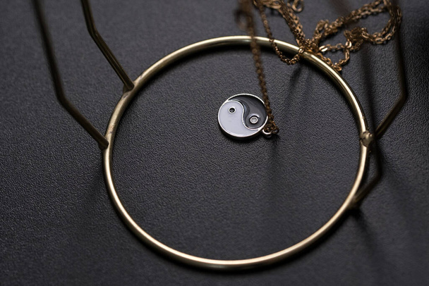 Yin Yang pendant necklace handmade black and white closeup. Selective Focus - Фото, зображення