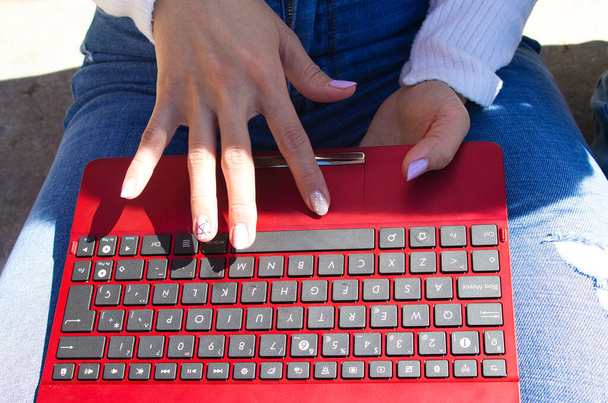detail of the hands of a woman teleworking from the terrace of her home anywhere in the world - Photo, Image