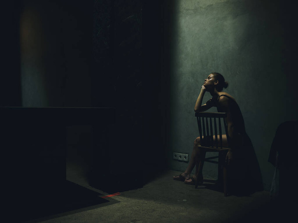 woman loneliness dark interior model room depression conflict - Фото, изображение