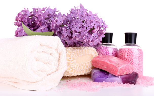 Composition with spa treatment, towels and lilac flowers, isolated on white - Фото, изображение