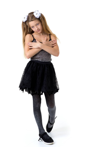 Girl with pigtails in fashionable clothes. Photo session in the studio - Photo, Image