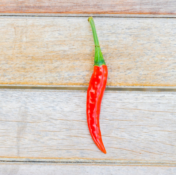 Chilli on wood background - Foto, afbeelding