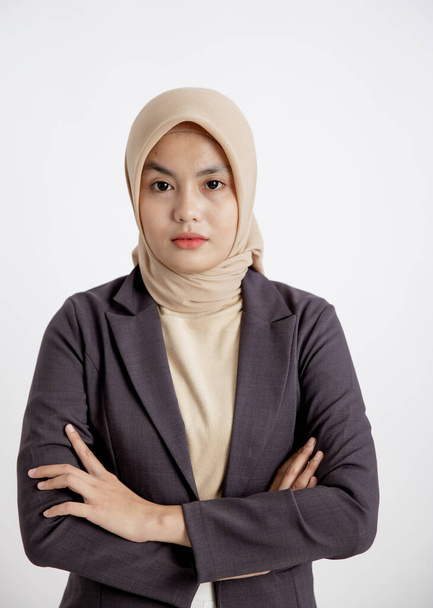 woman entrepreneur wearing hijab ready to work with crossed arms, office work concept - 写真・画像