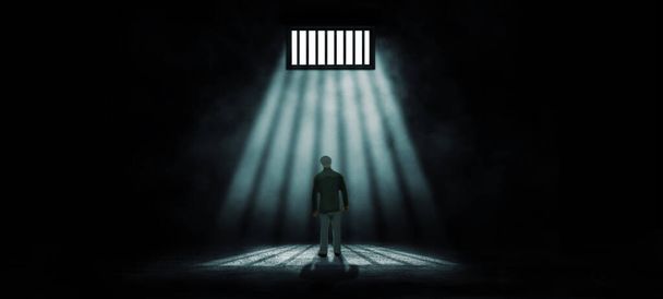Freedom Concept: Juguete modelo miniatura de personas parado en prisión dentro con iluminación solar a través de una ventana en un cuarto oscuro. - Foto, imagen