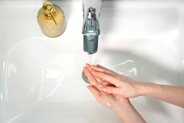 Hands hygiene background. Female hands washing. Top view. - Foto, Bild