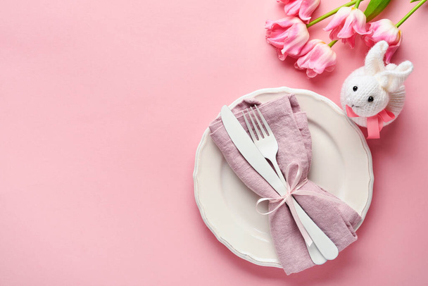 Easter table setting with floral decor on pink table. Elegance dinner. Mock up. Top view. - Fotó, kép