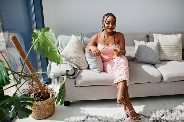 Fashionable photo of young beautiful romantic african american woman with glass of wine, wearing pink dress. Summer, spring style. - Φωτογραφία, εικόνα