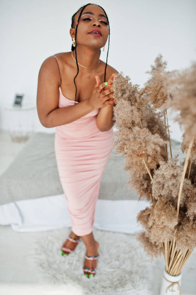Fashionable photo of young beautiful romantic african american woman with perfect makeup, wearing pink dress. Summer, spring style. - Фото, зображення