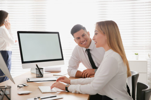 Man flirting with his colleague during work in office - Foto, Imagen
