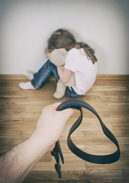 Little girl crying in the corner. Domestic violence concept. - Фото, изображение