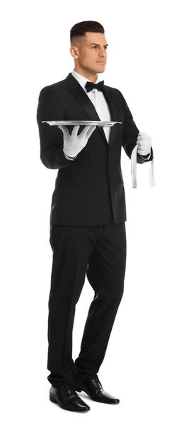 Elegant butler holding silver tray isolated on white - Foto, afbeelding