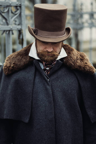 Portrait of a man in elegant suit  and hat, retro old fashioned style - Фото, зображення