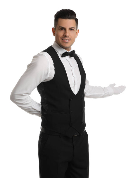 Handsome butler in elegant uniform on white background - Photo, Image