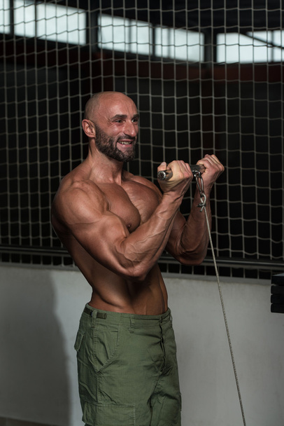 Mature Bodybuilder Exercising Biceps - Photo, Image