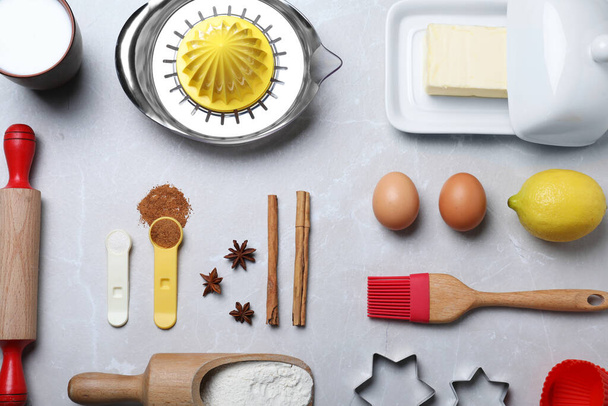 Cooking utensils and ingredients on light marble table, flat lay - Фото, изображение